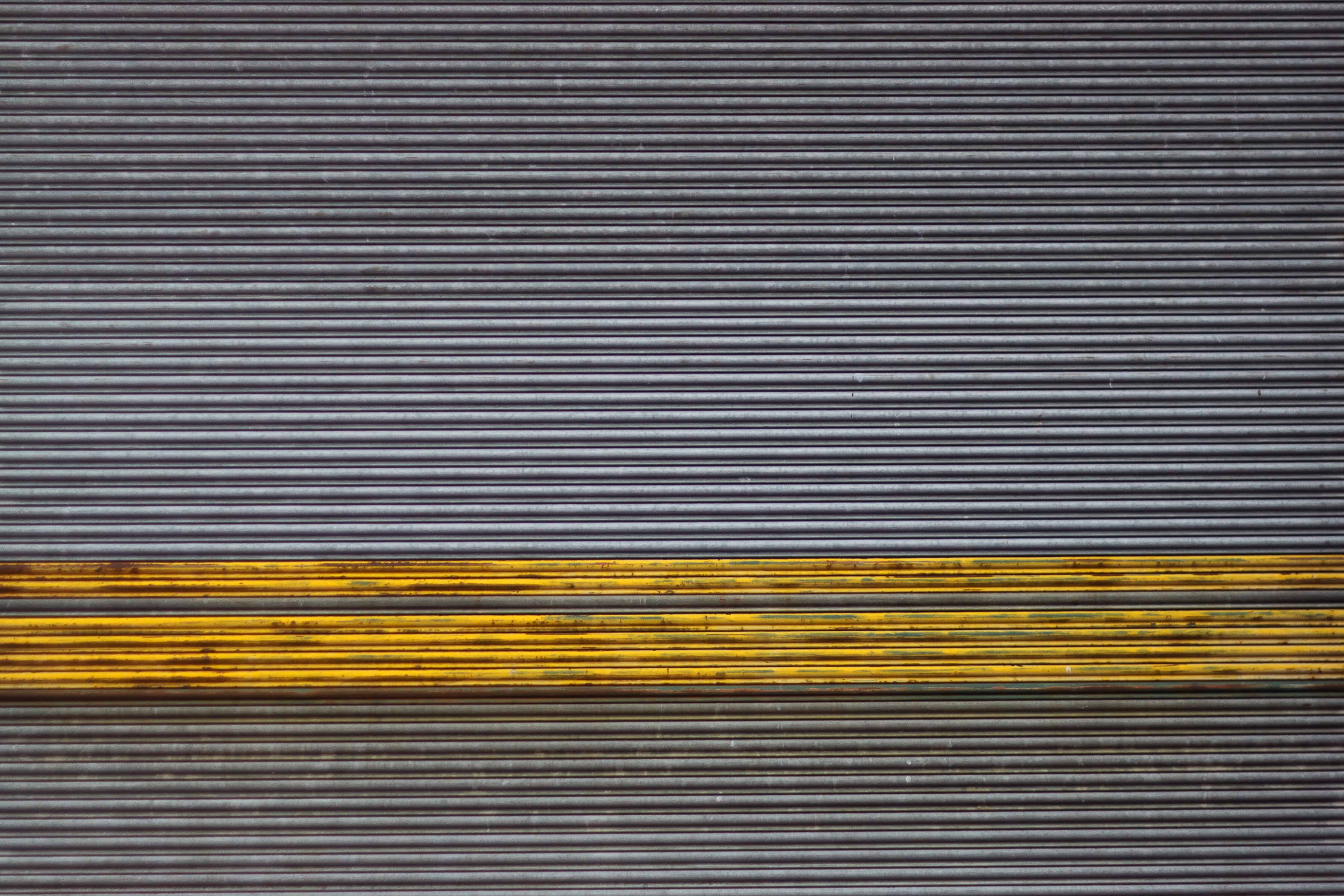 silver roller shutter with yellow line across