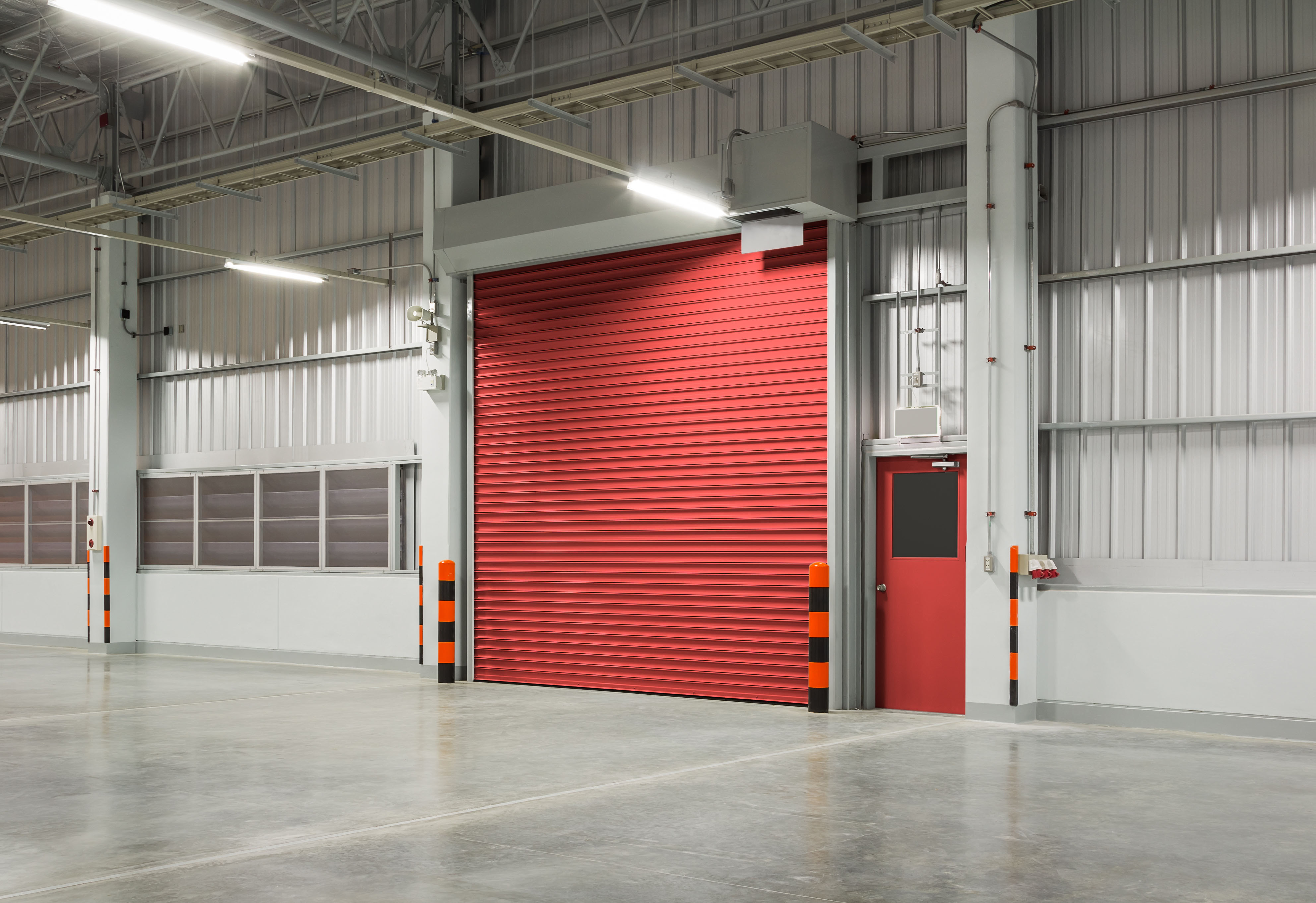 Sectional Overhead Doors vs Roller Shutters: What’s the Right Fit for Your Site?